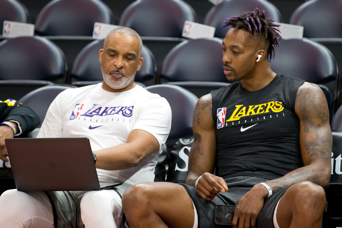 Lakers assistant coach Phil Handy, left, talks with center Dwight Howard ahead of a recent game.