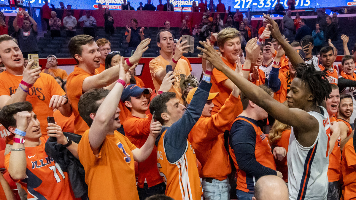 Illinois Fighting Illini guard Ayo Dosunmu (11) celebrates with fans after a game against the Iowa Hawkeyes at State Farm Center.