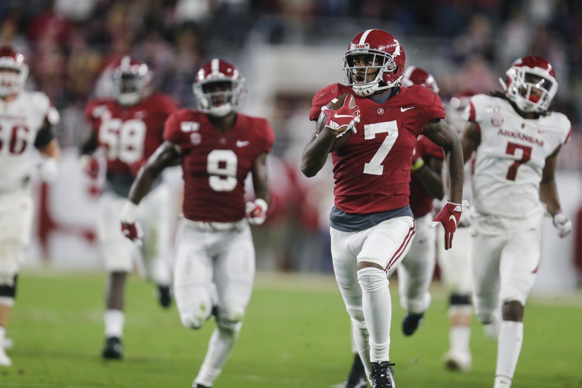Oct 26, 2019; Tuscaloosa, AL, USA; Alabama Crimson Tide defensive back Trevon Diggs (7) returns an interception for a touchdown during the first half of an NCAA college football game at Bryant-Denny Stadium.