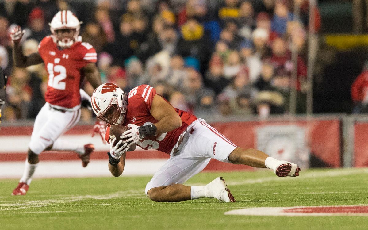Wisconsin Badgers linebacker Christian Bell (55) intercepts a pass during the third quarter against the Iowa Hawkeyes at Camp Randall Stadium.