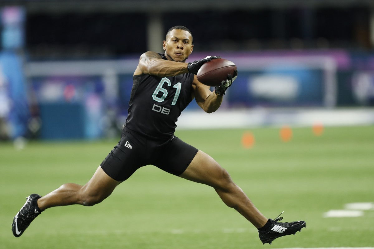 Mar 1, 2020; Indianapolis, Indiana, USA; Minnesota Golden Gophers defensive back Antoine Winfield Jr (DB61) goes through pass catching workout drills during the 2020 NFL Combine at Lucas Oil Stadium.