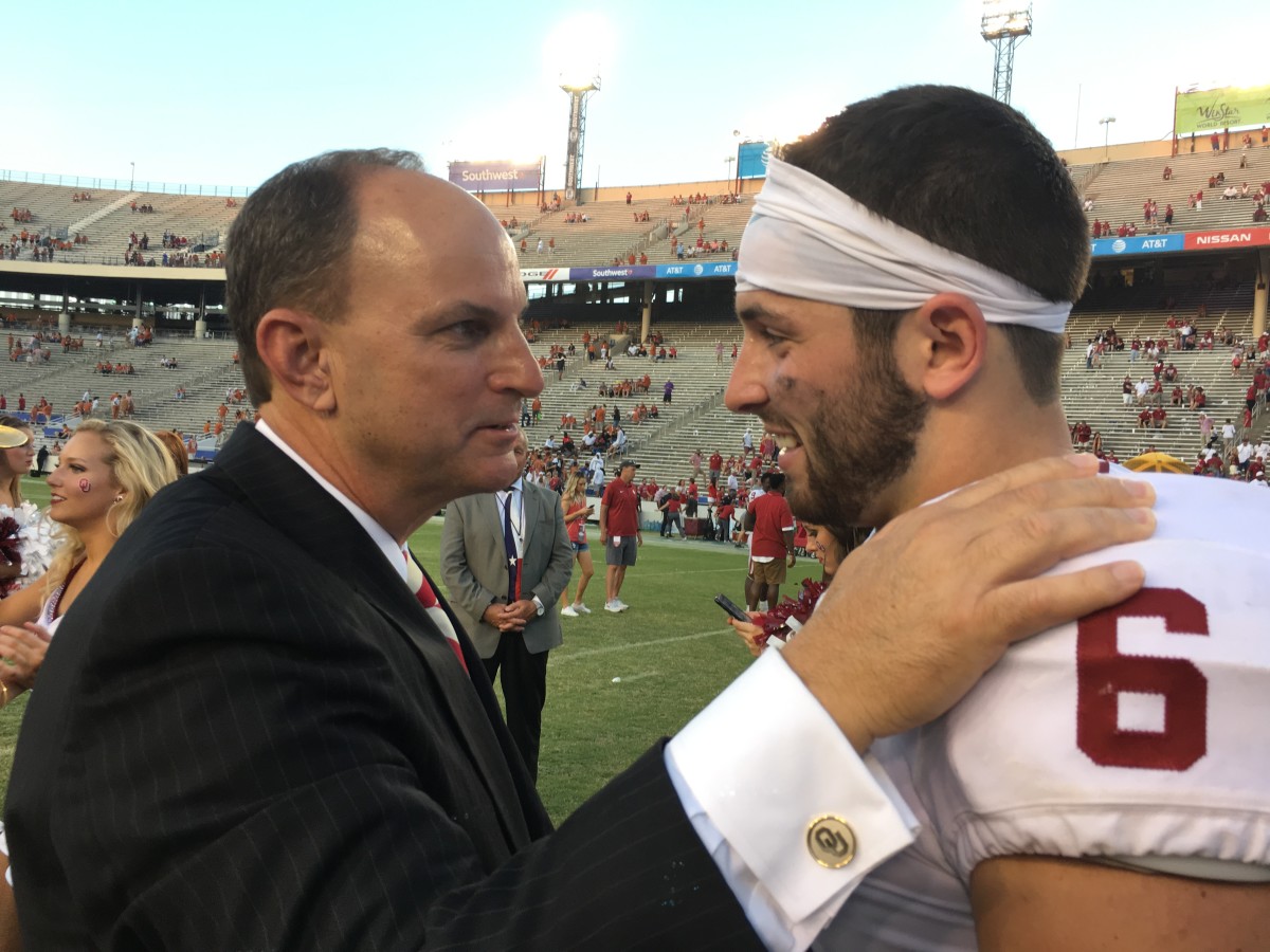 Oklahoma athletic director Joe Castiglione (left) celebrates the Sooners' 2017 win over Texas with quarterback Baker Mayfield.