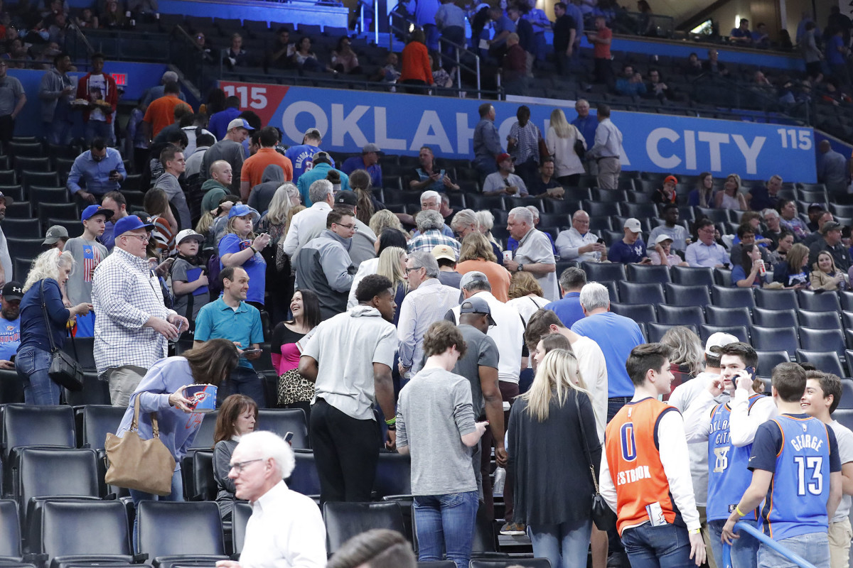 Fans leave after being told the Oklahoma City Thunder vs. Utah Jazz game had been cancelled just before tip off.