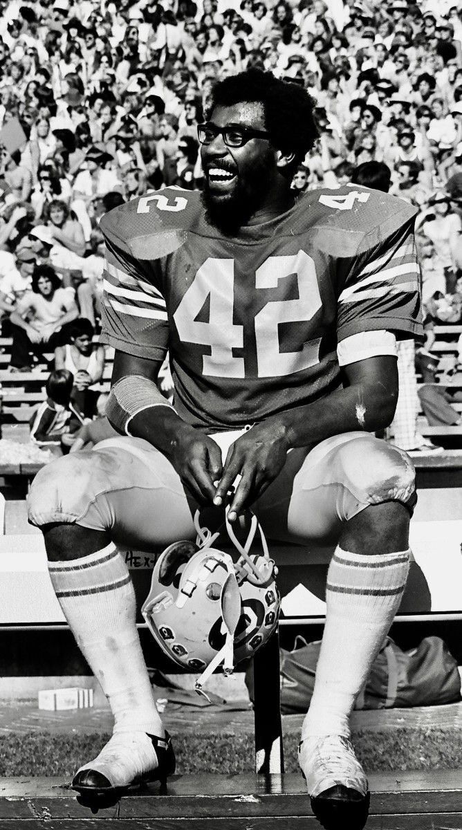 Chuck Muncie enjoys a happy sideline moment with Cal