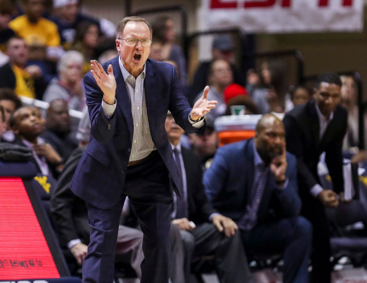 Oklahoma Sooners head coach Lon Kruger yells from the bench during the second half against the West Virginia Mountaineers at WVU Coliseum.