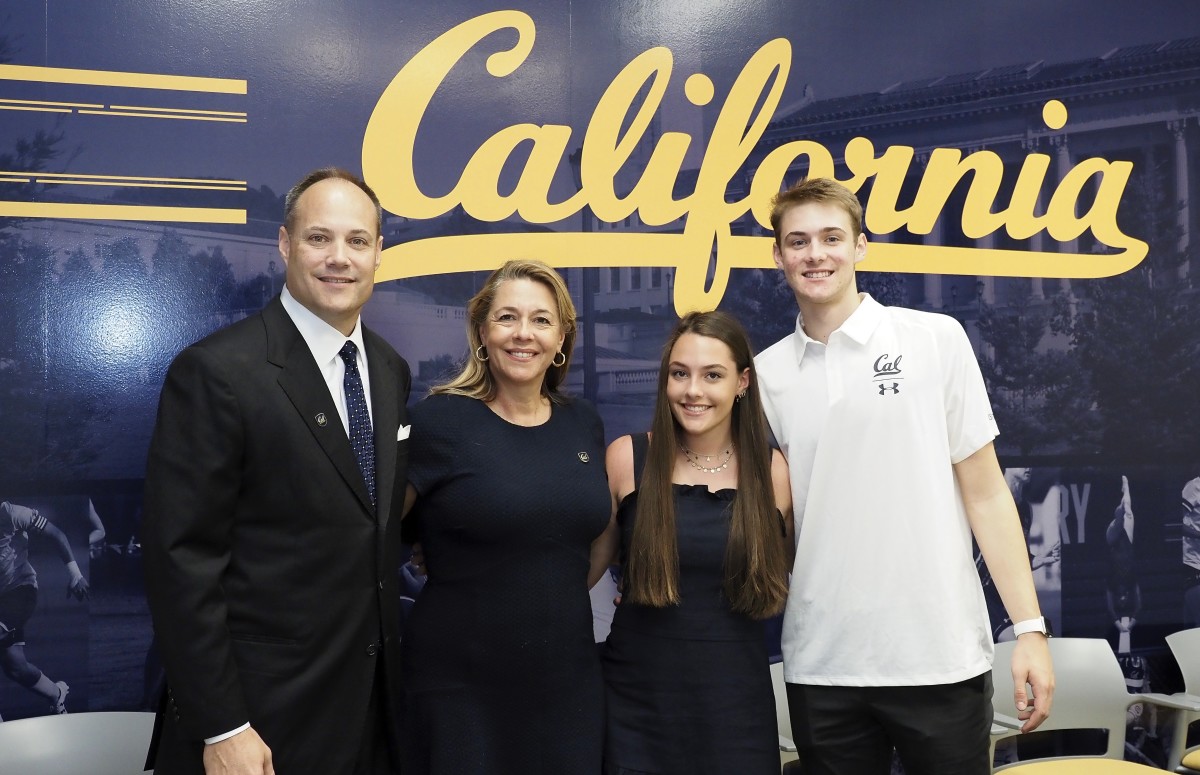 Cal coach Mark Fox, left, said he's happy to get more time with wife Cindy and kids Olivia and Parker
