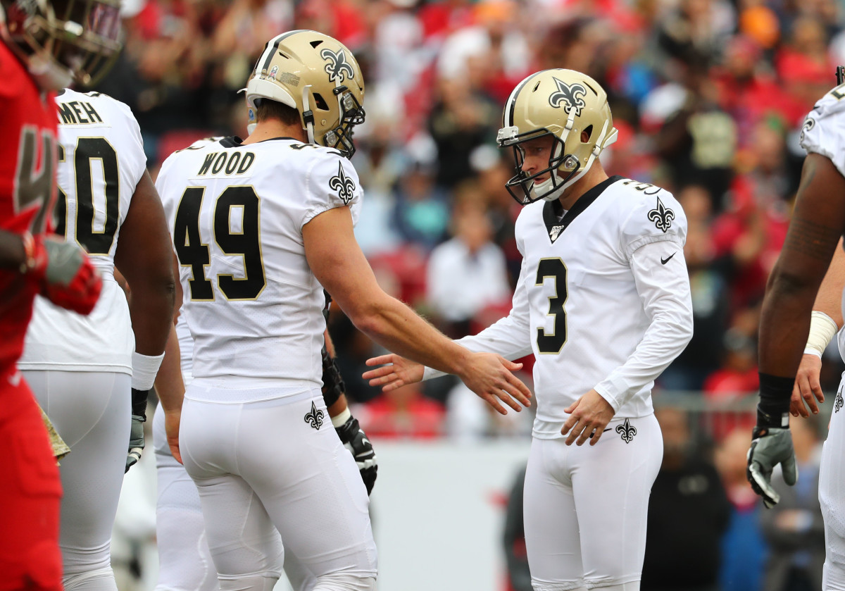 Nov 17, 2019; Tampa, FL, USA; New Orleans Saints kicker Wil Lutz (3) is congratulated by long snapper Zach Wood (49) after kicking a field goal against the Tampa Bay Buccaneers during the first half at Raymond James Stadium. Mandatory Credit: Kim Klement-USA TODAY Sports
