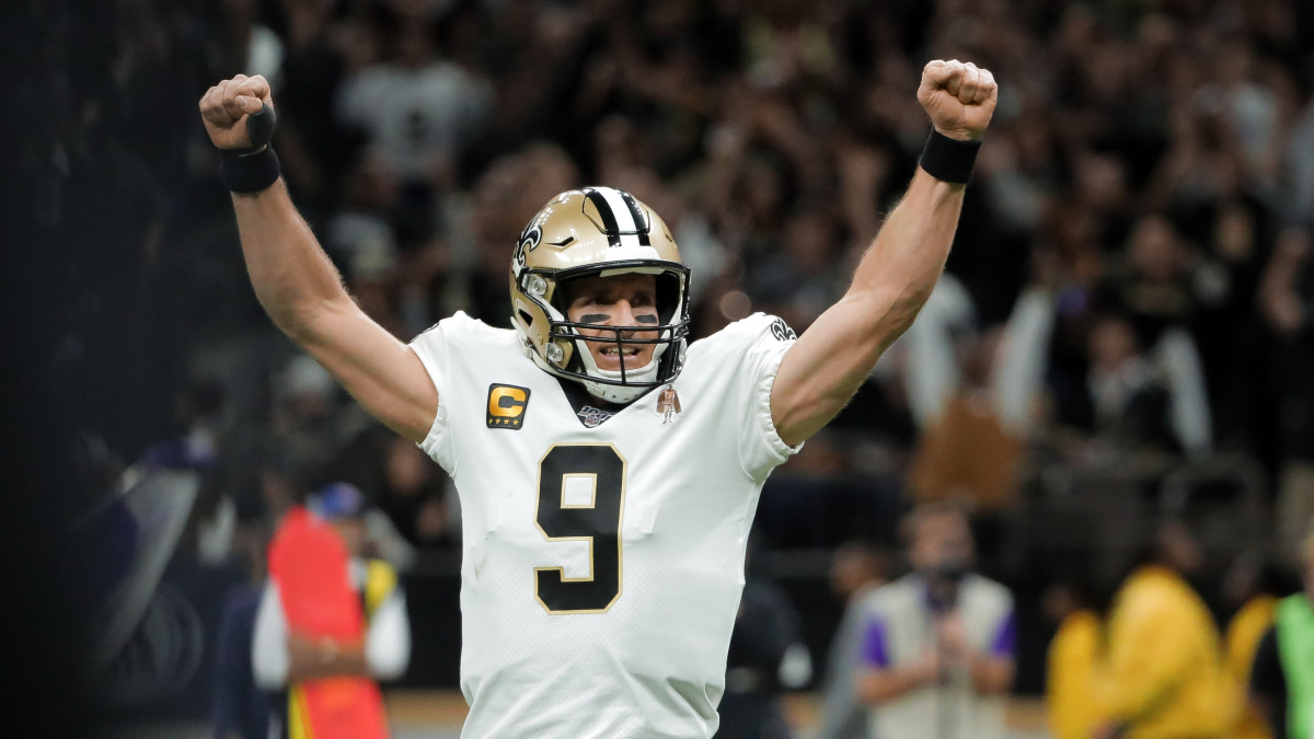 Drew Brees celebrates on the field at the SuperDome.