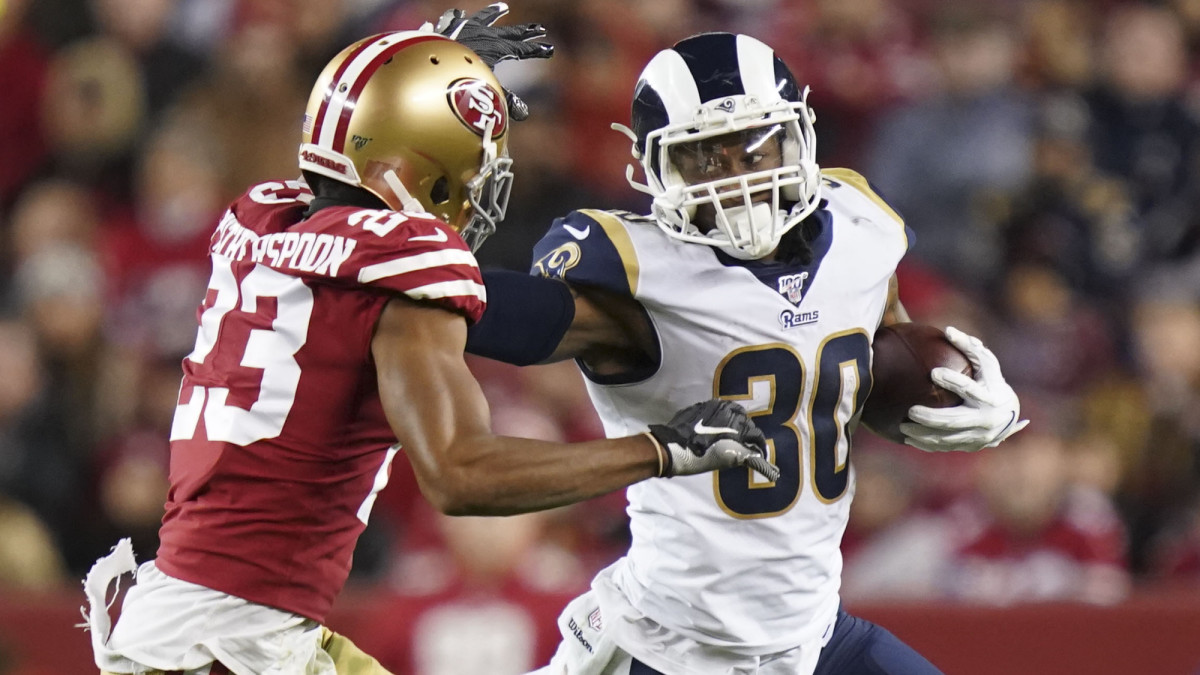 Los Angeles Rams running back Todd Gurley runs with the football against San Francisco 49ers cornerback Ahkello Witherspoon during the third quarter at Levi's Stadium.