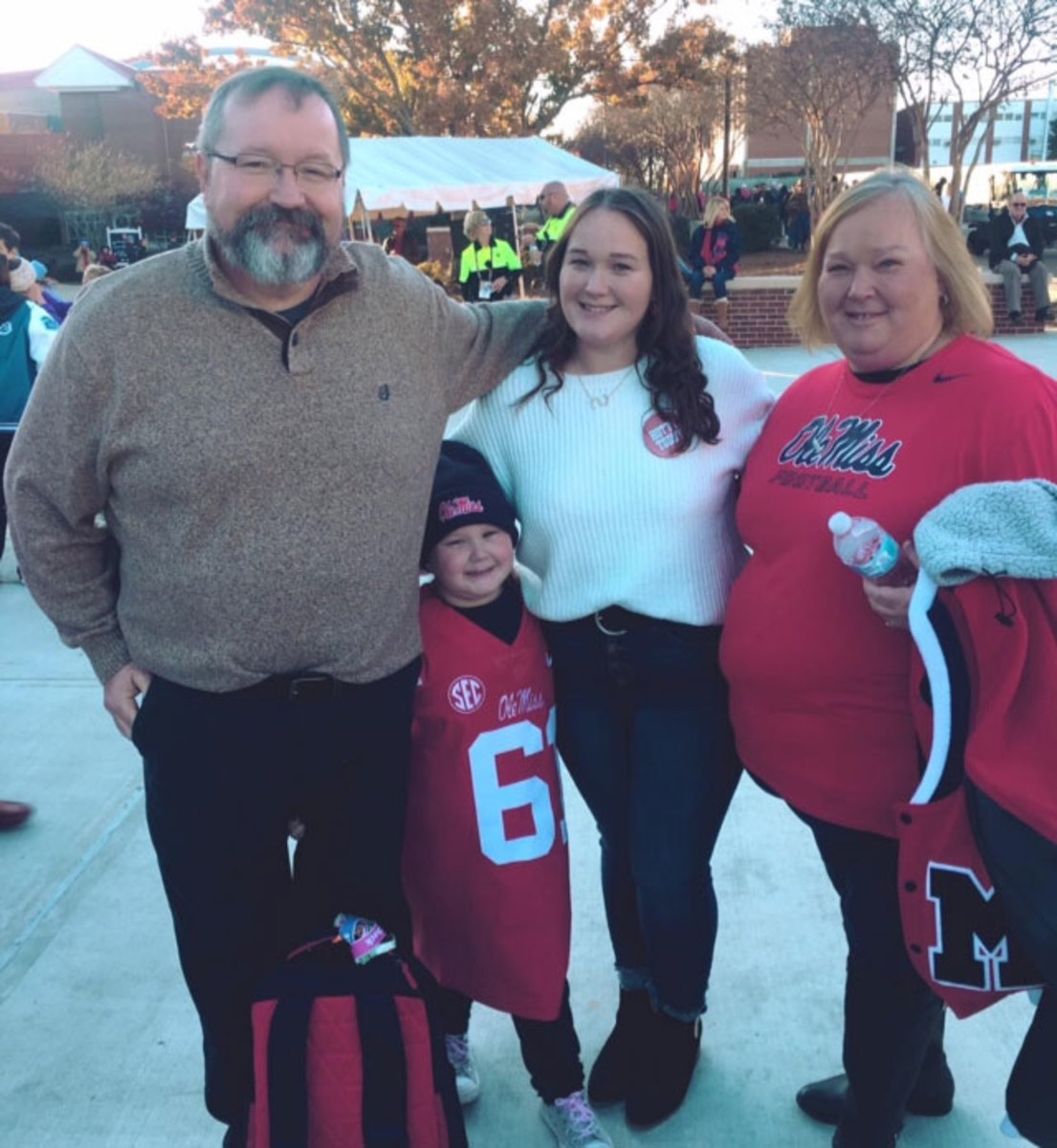 The parents and sisters of Ole Miss center Eli Johnson.