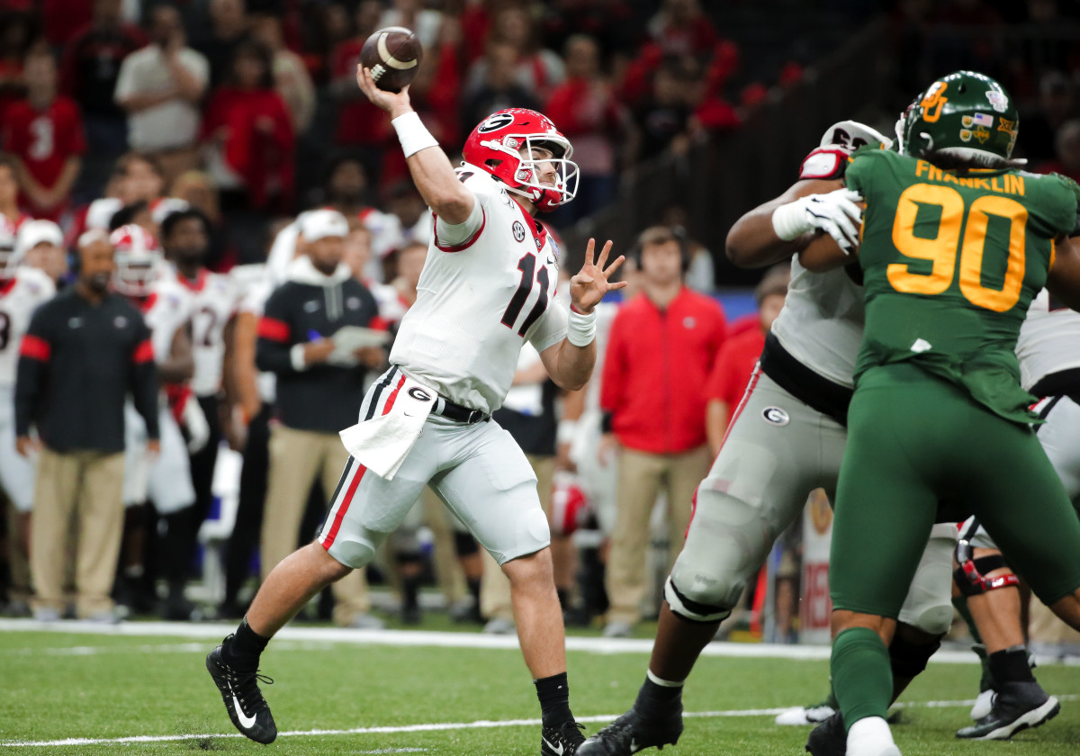 Jan 1, 2020; New Orleans, Louisiana, USA; Georgia Bulldogs quarterback Jake Fromm (11) throws a touchdown against the Baylor Bears during the second quarter at the Mercedes-Benz Superdome. Mandatory Credit: Derick E. Hingle-USA TODAY Sports