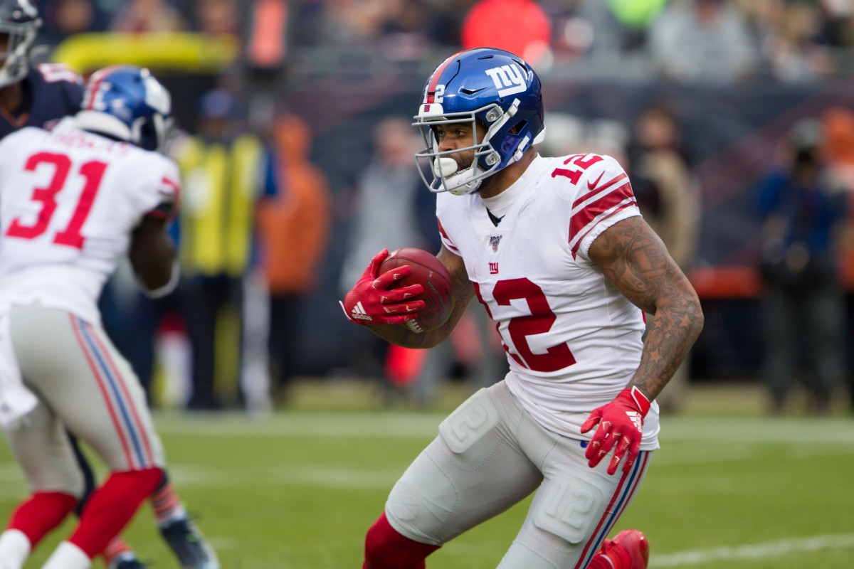 Nov 24, 2019; Chicago, IL, USA; New York Giants wide receiver Cody Latimer (12) runs with the football in the second half against the Chicago Bears at Soldier Field.