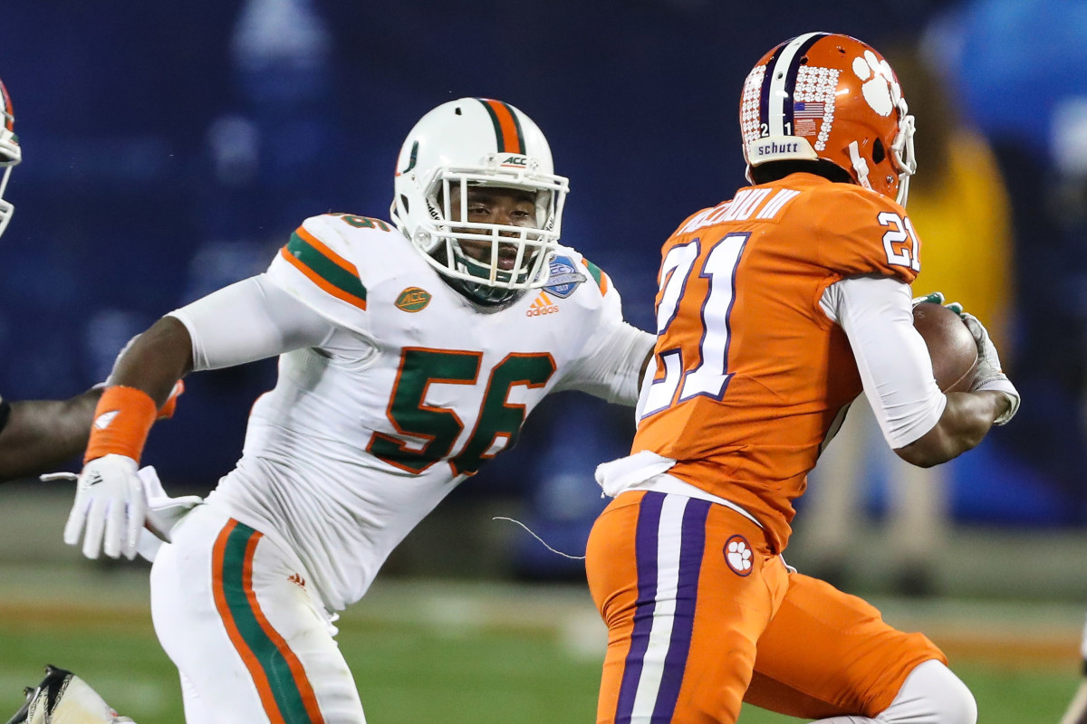 Dec 2, 2017; Charlotte, NC, USA; Miami Hurricanes linebacker Michael Pinckney (56) chases Clemson Tigers wide receiver Ray-Ray McCloud (21) during the third quarter of the ACC championship game at Bank of America Stadium. Mandatory Credit: Jim Dedmon-USA TODAY Sports