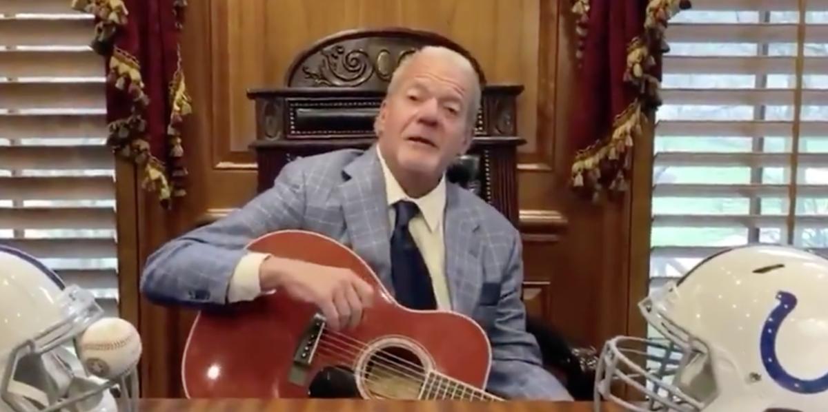 Indianapolis Colts owner Jim Irsay holds a guitar after singing a Bob Seger song for fans on Friday.