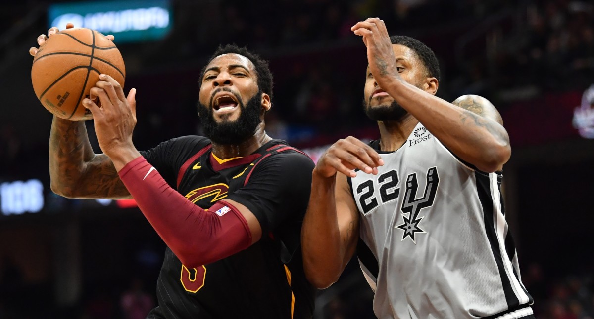 Cleveland Cavaliers center Andre Drummond drives to the basket against San Antonio Spurs forward Rudy Gay during a game at Rocket Mortgage FieldHouse.