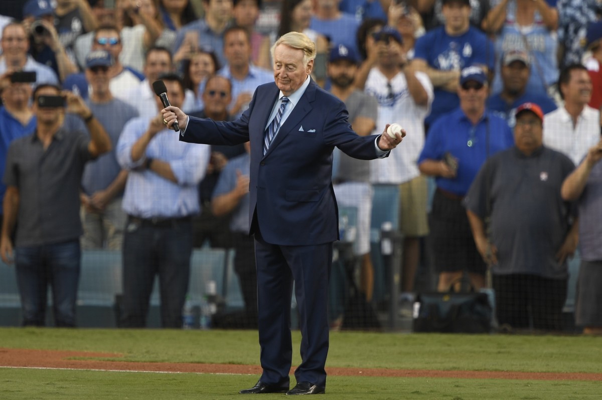 Oct 25, 2017; Los Angeles, CA, USA; Los Angeles Dodgers former announcer Vin Scully address the stadium before game two of the 2017 World Series between the Los Angeles Dodgers and the Houston Astros at Dodger Stadium. Mandatory Credit: Robert Hanashiro-USA TODAY Sports