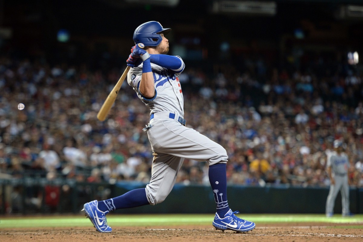 Sep 1, 2019; Phoenix, AZ, USA; Los Angeles Dodgers right fielder Cody Bellinger (35) hits a solo home run against the Arizona Diamondbacks during the ninth inning at Chase Field. Mandatory Credit: Joe Camporeale-USA TODAY Sports