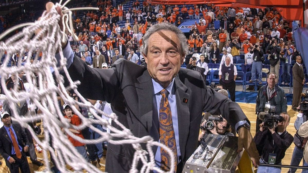 Coach Sutton cuts down the nets after a Big 12 Tournament Championship in Kansas City.