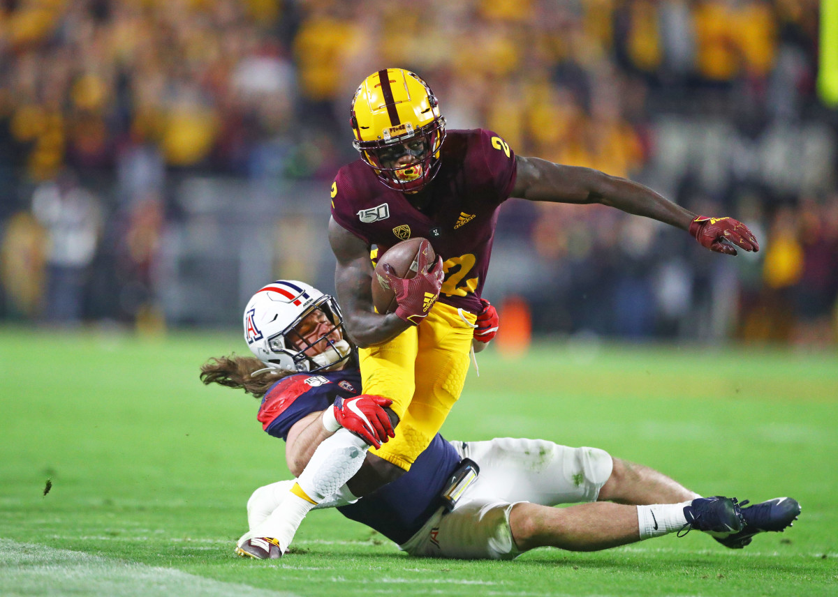Nov 30, 2019; Tempe, AZ, USA; Arizona State Sun Devils wide receiver Brandon Aiyuk (2) is tackled by Arizona Wildcats linebacker Colin Schooler during the first half of the Territorial Cup at Sun Devil Stadium. Mandatory Credit: Mark J. Rebilas-USA TODAY Sports