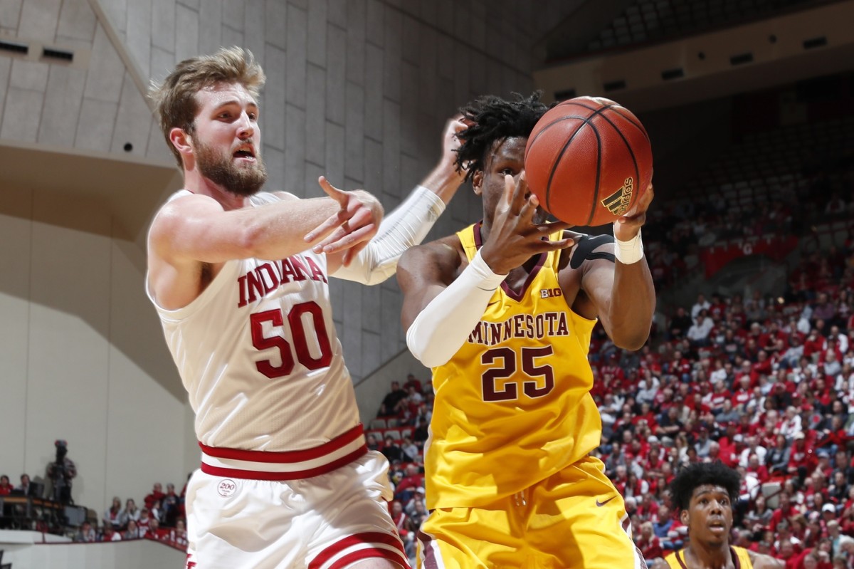 Indiana forward Joey Brunk (50) battles for a loose ball with Minnesota's Daniel Oturu on March 4, the day Brunk snapped out of his slump. (USA TODAY Sports)