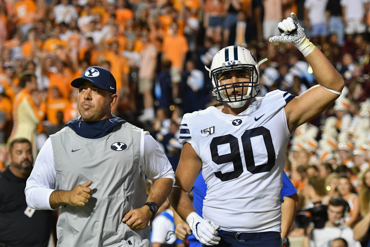 Sep 7, 2019; Knoxville, TN, USA; Brigham Young Cougars defensive lineman Devin Kaufusi (90) signals to the crowd after being ejected for targeting during the second half against the Tennessee Volunteers at Neyland Stadium. BYU won 29 to 26 in the second overtime. Mandatory Credit: Randy Sartin-USA TODAY Sports