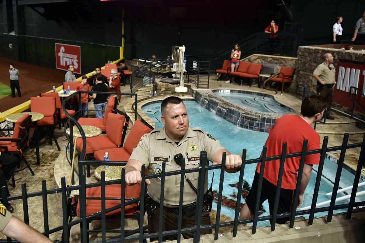 Oct 9, 2017; Phoenix, AZ, USA; Police and venue security guard the pool area following the Los Angeles Dodgers victory against the Arizona Diamondbacks in game three of the 2017 NLDS playoff baseball series at Chase Field. Mandatory Credit: Matt Kartozian-USA TODAY Sports