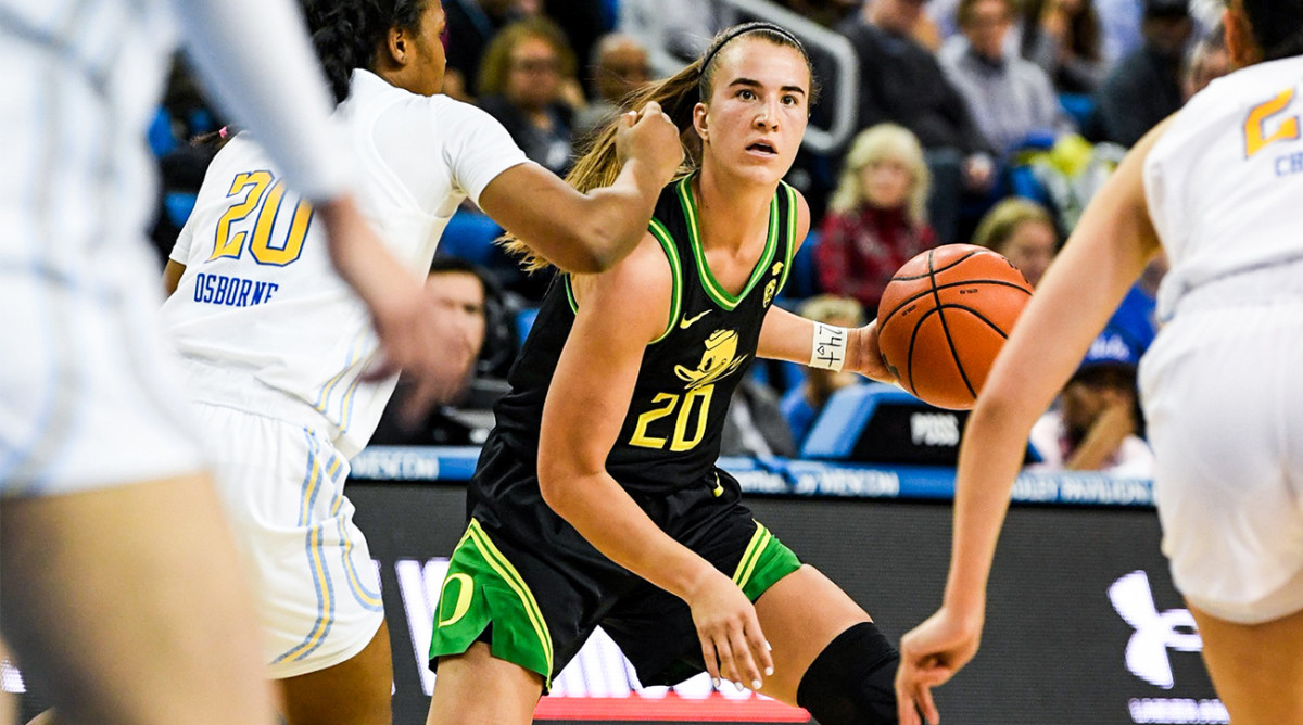 Sabrina Ionescu dribbles