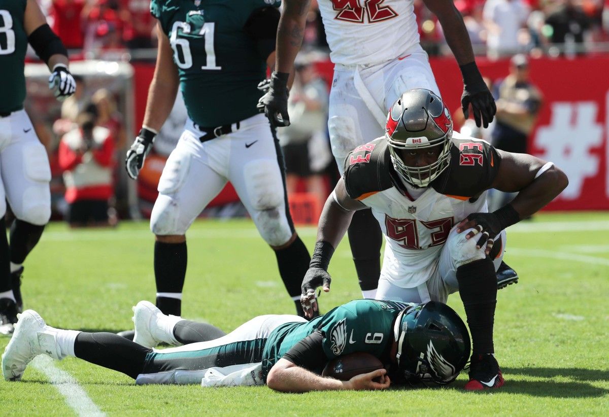 Gerald McCoy and former Eagles quarterback Nick Foles