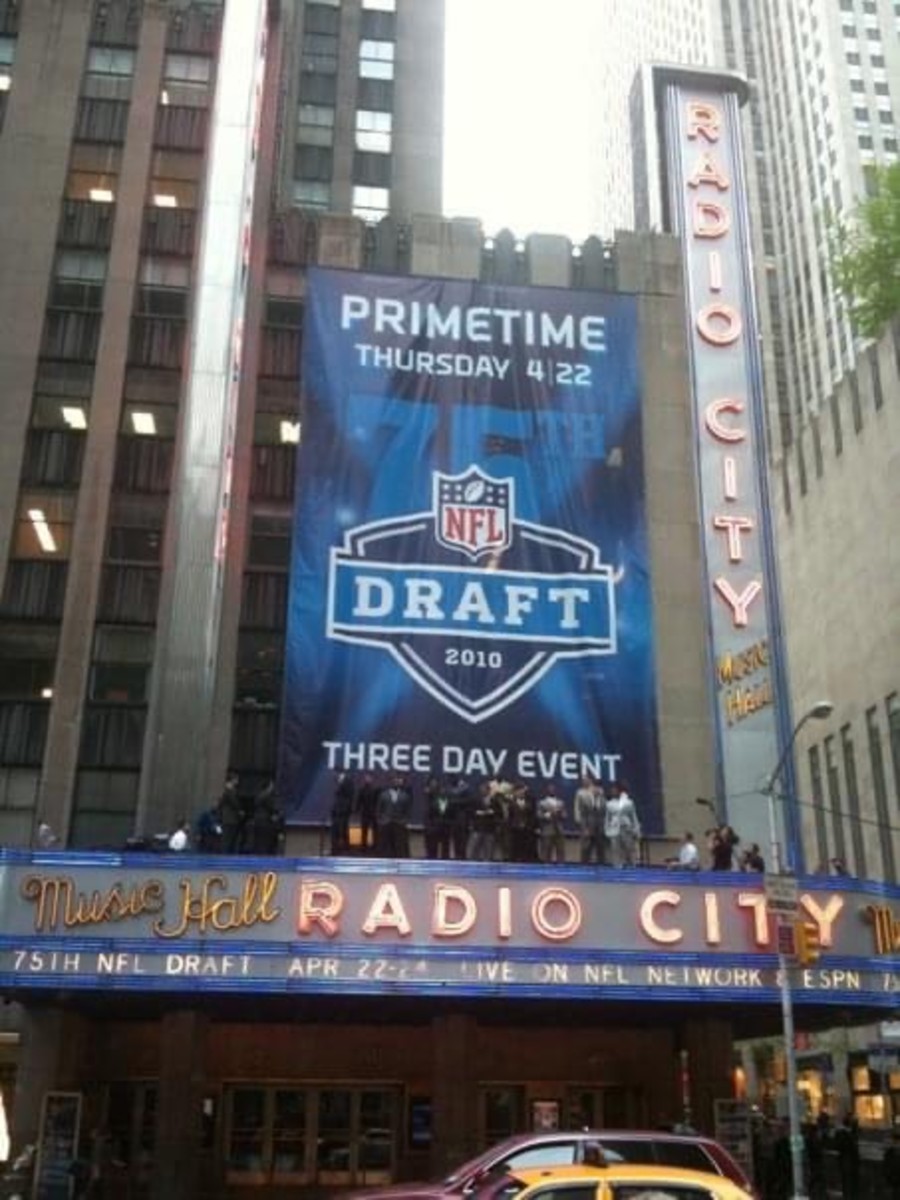 NFL prospects pose atop the Radio City marquee.