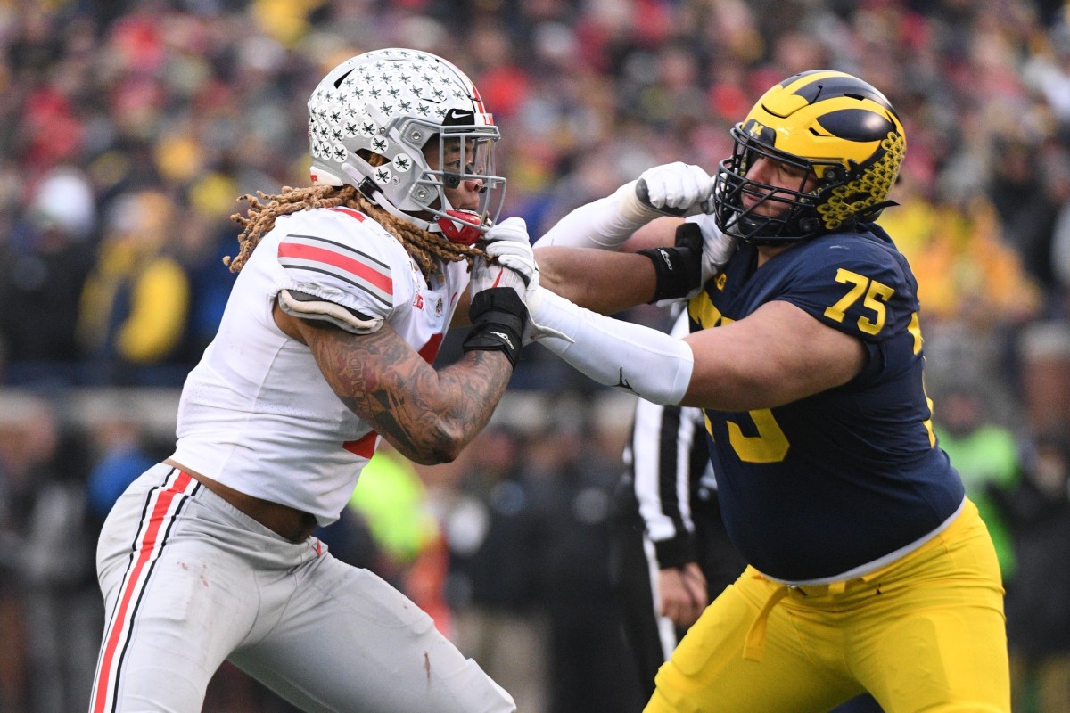 Michigan offensive tackle Jon Runyan (75), shown blocking top-five prospect Chase Young of Ohio State, is projected as a late-round pick in the NFL draft.