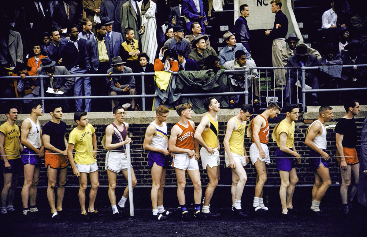 High school runners await their leg in the 1954 mile relay.