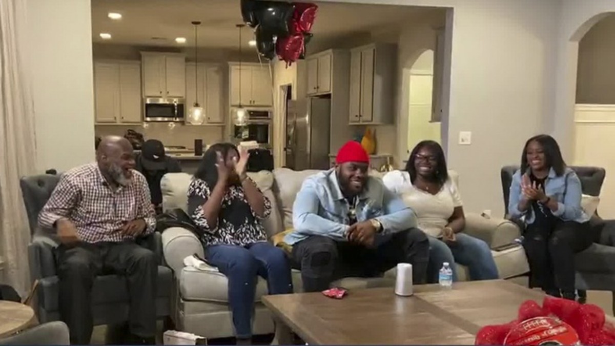 Apr 23, 2020; In this still image from video provided by the NFL, Andrew Thomas, center, smiles during the 2020 NFL Draft. Thomas was selected number four overall to the New York Giants.