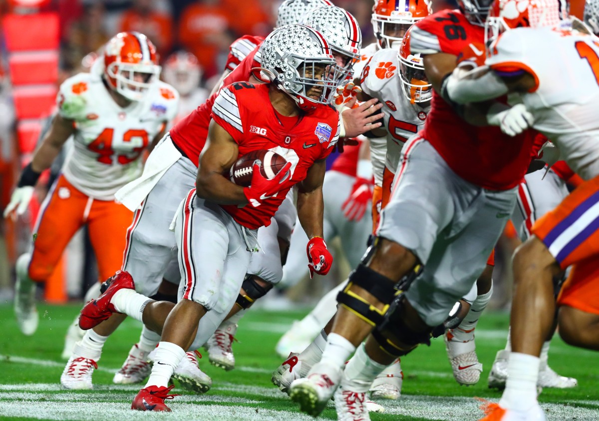 Dec 28, 2019; Glendale, Arizona, USA; Ohio State Buckeyes running back J.K. Dobbins (2) runs with the ball against the Clemson Tigers in the 2019 Fiesta Bowl college football playoff semifinal game. Mandatory Credit: Matthew Emmons-USA TODAY Sports