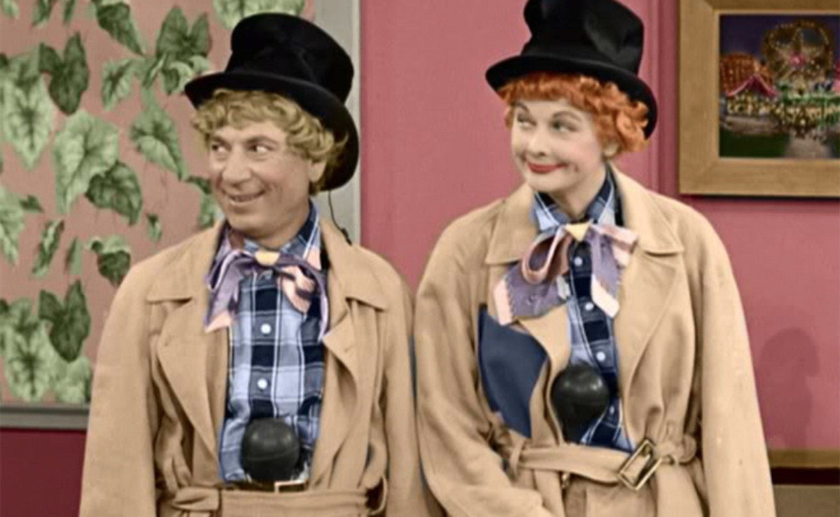 Harpo Marx and Lucille Ball demonstrate proper horn storage for fielders.