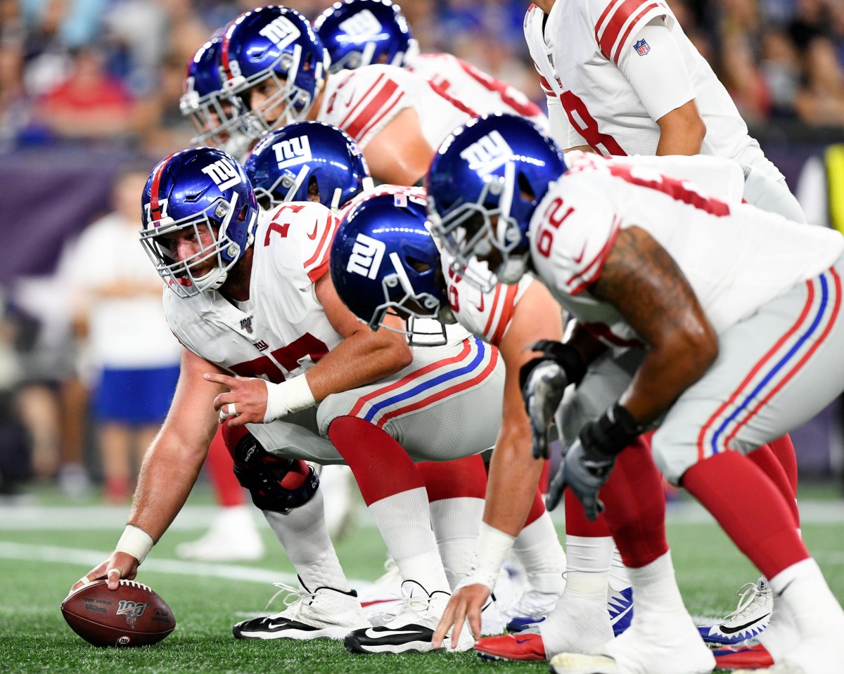 Aug 29, 2019; Foxborough, MA, USA; New York Giants center Spencer Pulley (77) prepares to snap the ball against the New England Patriots during the first half at Gillette Stadium.