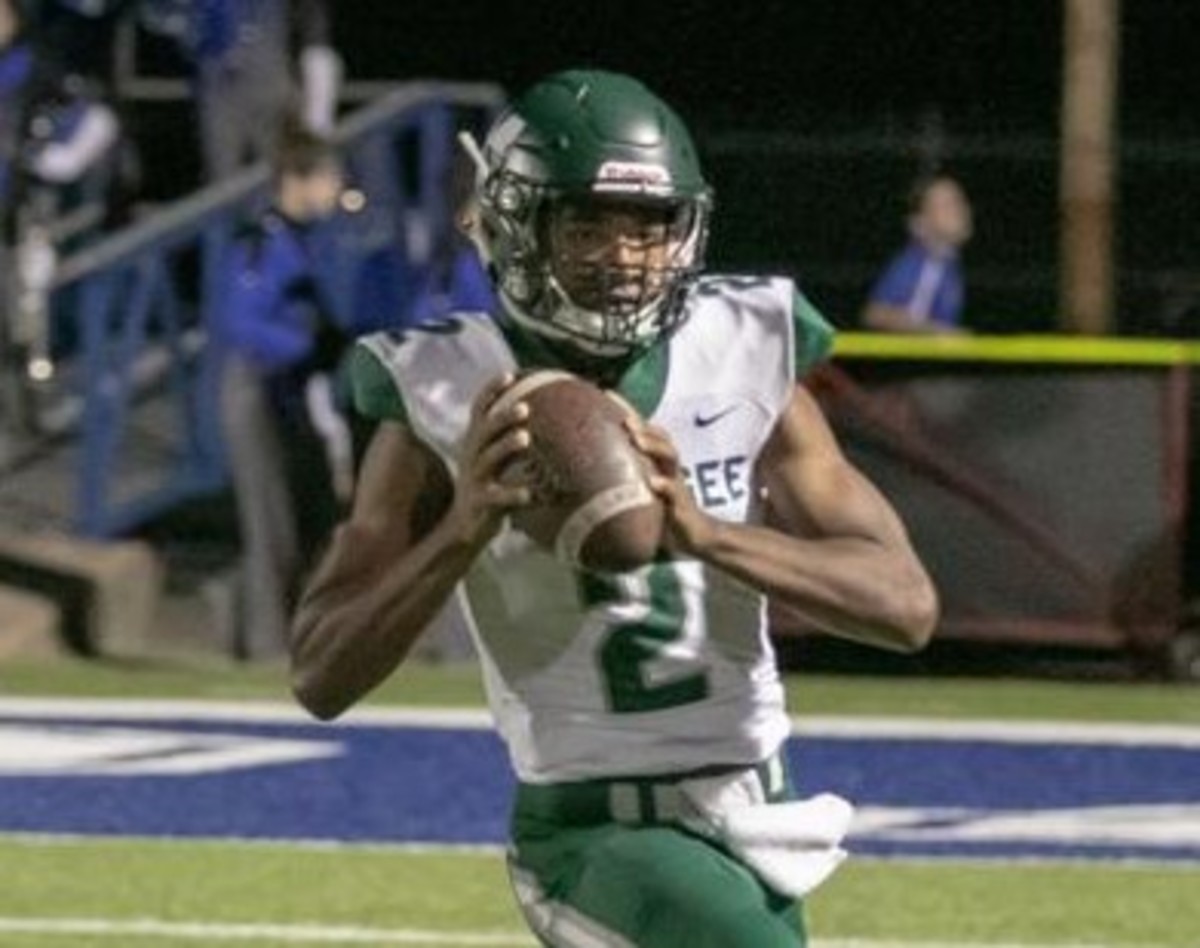 Ty Williams playing quarterback for Muskogee.