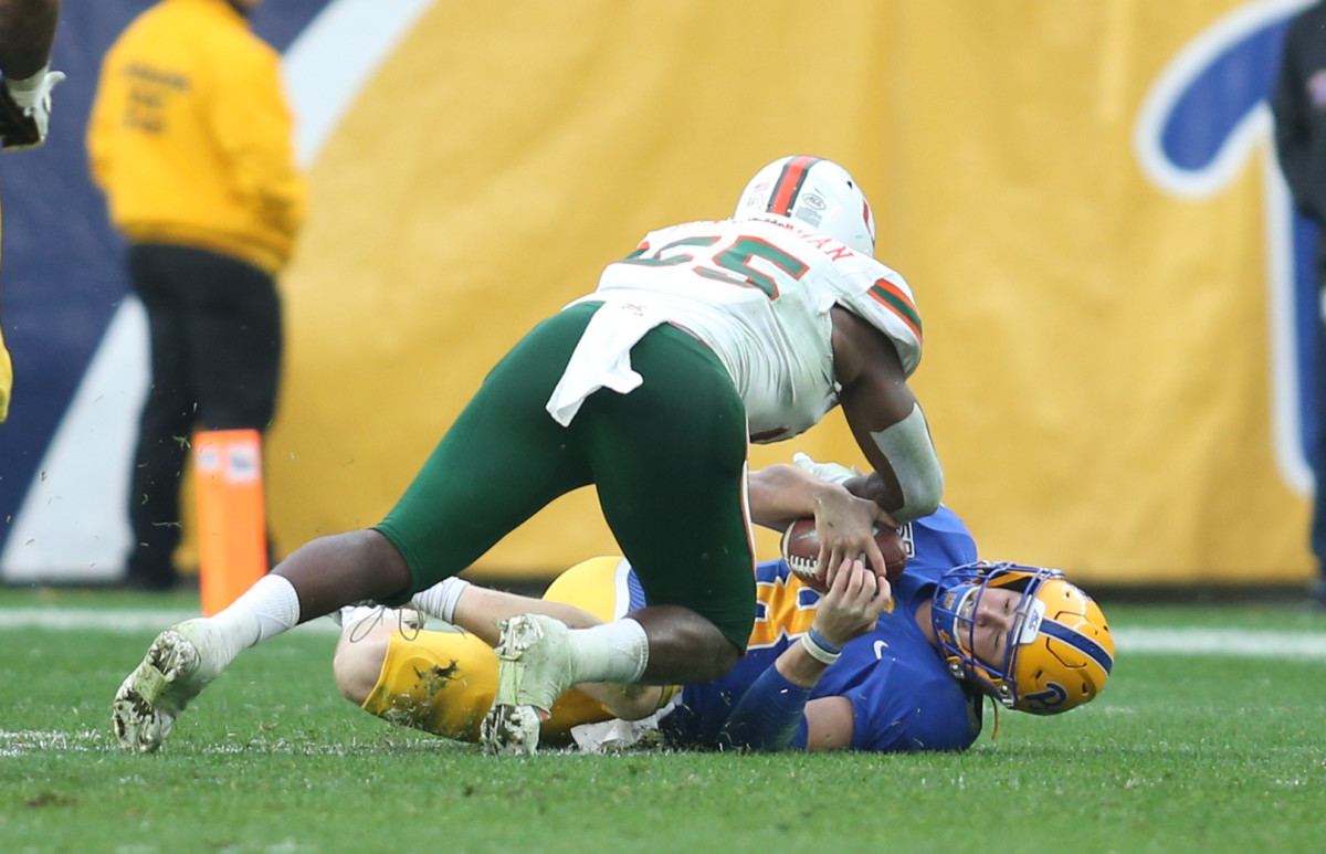 Oct 26, 2019; Pittsburgh, PA, USA; Miami Hurricanes linebacker Shaquille Quarterman (55) sacks Pittsburgh Panthers quarterback Kenny Pickett (8) during the fourth quarter at Heinz Field. Miami won 16-12. Mandatory Credit: Charles LeClaire-USA TODAY Sports