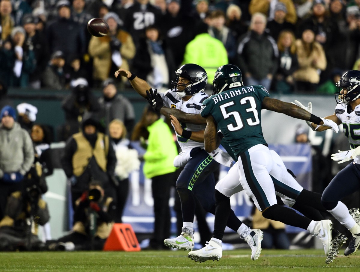 Jan 5, 2020; Philadelphia, Pennsylvania, USA; Seattle Seahawks quarterback Russell Wilson (3) passes as Philadelphia Eagles outside linebacker Nigel Bradham (53) defends during the first quarter in a NFC Wild Card playoff football game at Lincoln Financial Field. Mandatory Credit: James Lang-USA TODAY Sports