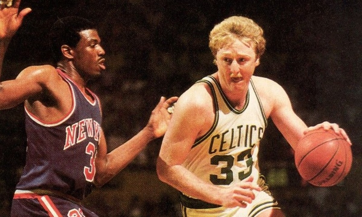 Boston Celtics legend Larry Bird drives to the basket vs. New York Knicks scoring machine Bernard King in the 1980s.