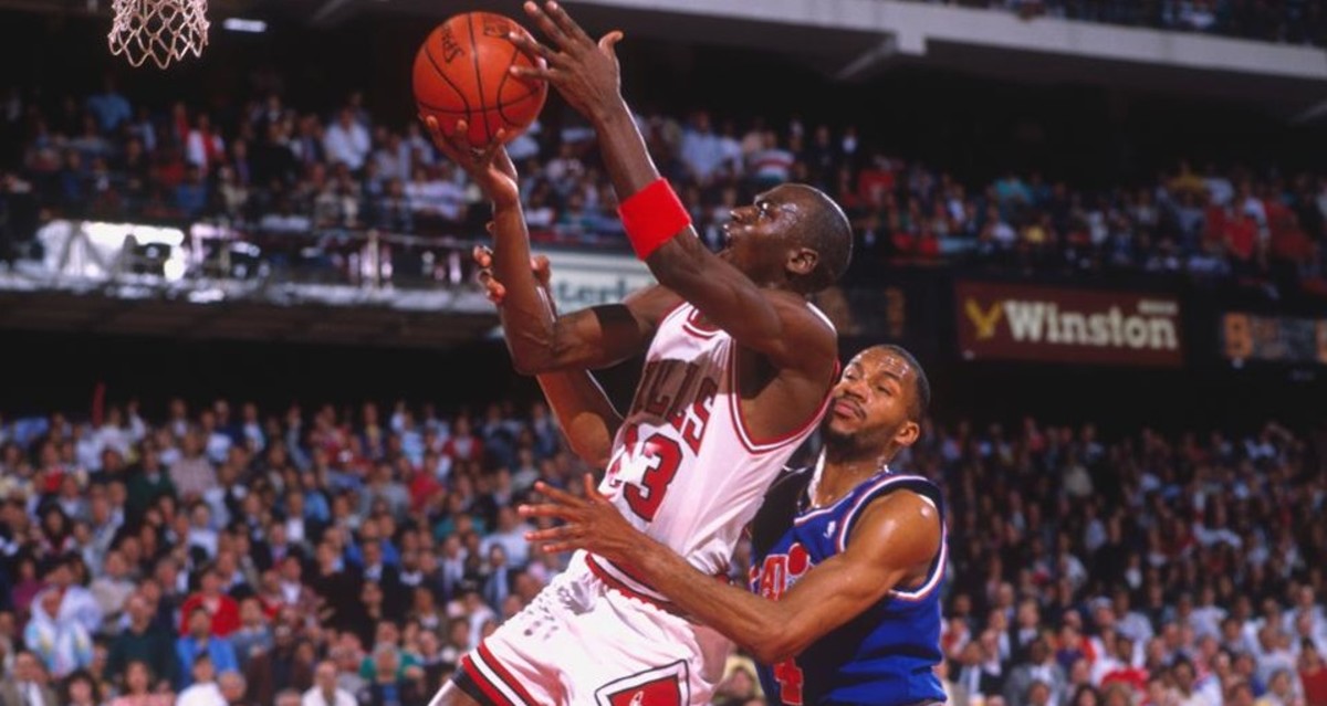 Chicago Bulls legend Michael Jordan drives to the basket vs. Ron Harper and the Cleveland Cavaliers in 1989.