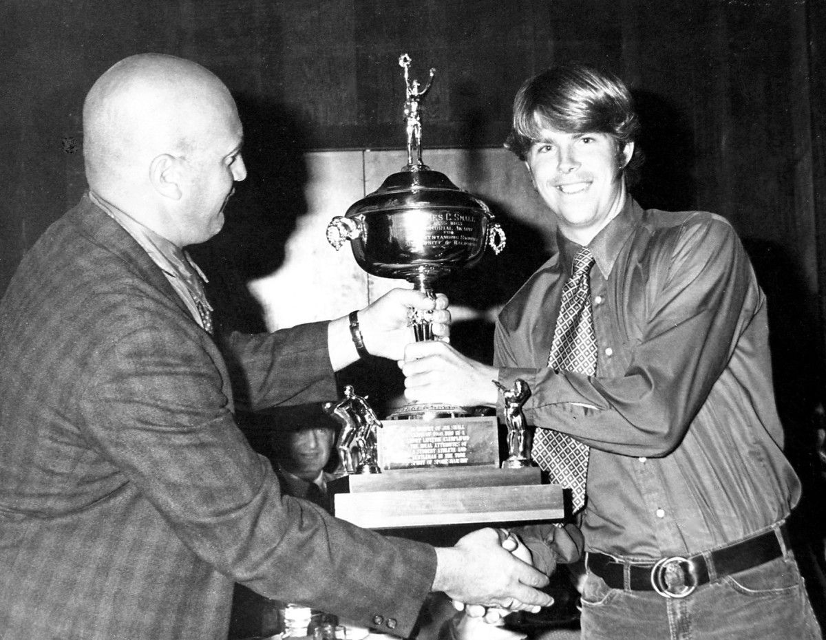 Peter Schnugg, right, is congratulated by coach Pete Cutino