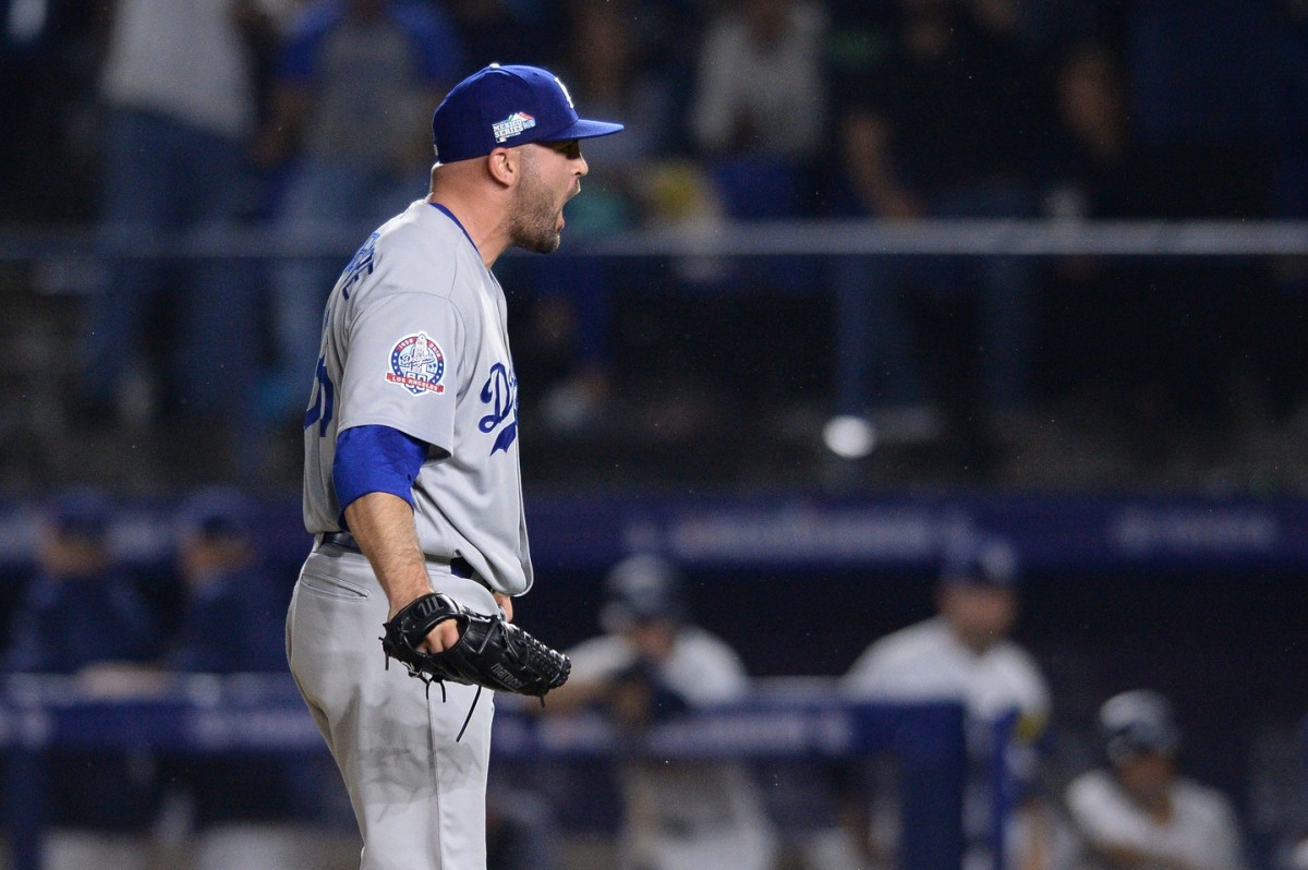 May 4, 2018; Monterrey, Nuevo Leon, Mexico; Los Angeles Dodgers relief pitcher Adam Liberatore reacts after recording the last out of the ninth inning against the San Diego Padres at Estadio de Beisbol Monterrey. The Dodgers did not allow a hit. Mandatory Credit: Orlando Ramirez-USA TODAY Sports
