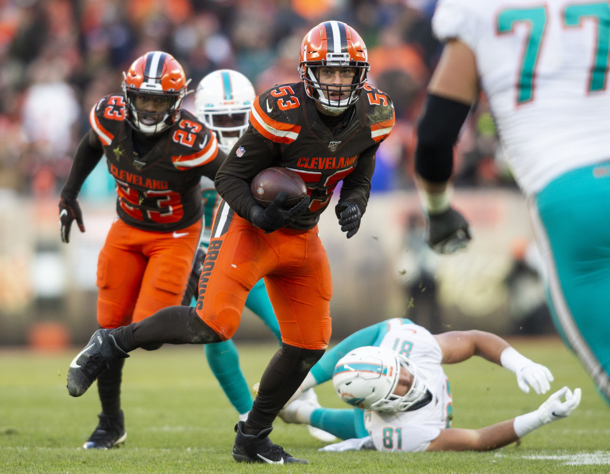 Nov 24, 2019; Cleveland, OH, USA; Cleveland Browns middle linebacker Joe Schobert (53) runs an interception back on a pass intended for Miami Dolphins tight end Durham Smythe (81) during the fourth quarter at FirstEnergy Stadium. The Browns won 41-24. Mandatory Credit: Scott R. Galvin-USA TODAY Sports