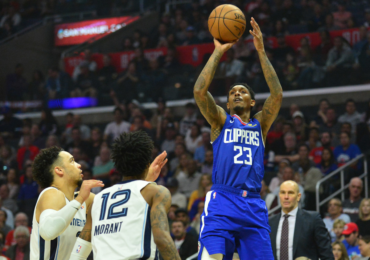 January 4, 2020; Los Angeles, California, USA; Los Angeles Clippers guard Lou Williams (23) shoots against Memphis Grizzlies guard Ja Morant (12) during the first half at Staples Center. Mandatory Credit: Gary A. Vasquez-USA TODAY Sports