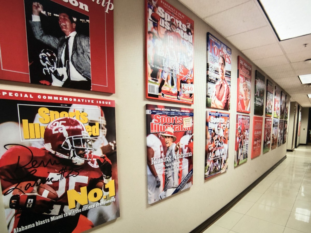 The hallway inside the Mal Moore Athletics Facility covered with magazine covers