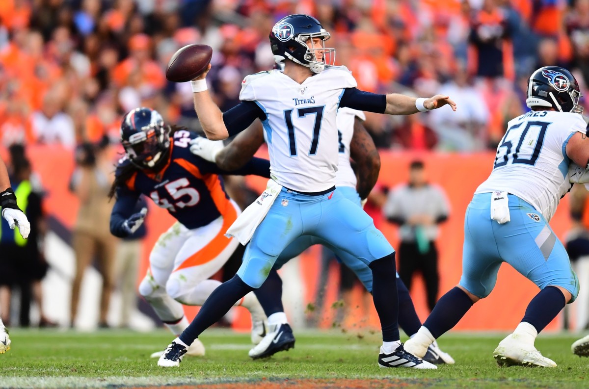 Tennessee Titans quarterback Ryan Tannehill (17) passes the ball in the fourth quarter against the against the Denver Broncos at Empower Field at Mile High.