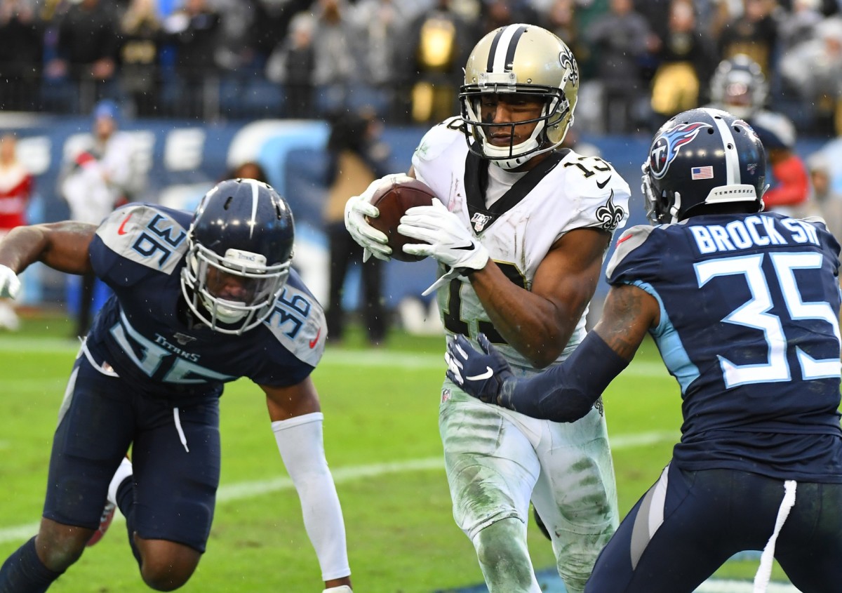 Dec 22, 2019; Nashville, Tennessee, USA; New Orleans Saints wide receiver Michael Thomas (13) breaks the record for receptions in a season with this touchdown reception during the second half against the Tennessee Titans at Nissan Stadium. Mandatory Credit: Christopher Hanewinckel-USA TODAY Sports