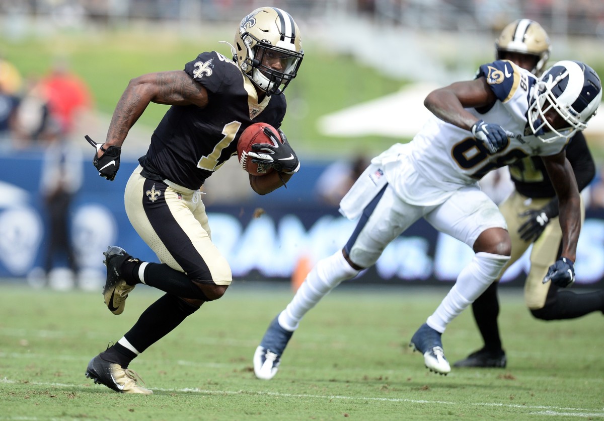 September 15, 2019; Los Angeles, CA, USA; New Orleans Saints wide receiver Deonte Harris (11) runs the ball on a punt return against Los Angeles Rams wide receiver Mike Thomas (88) during the first half at Los Angeles Memorial Coliseum. Mandatory Credit: Gary A. Vasquez-USA TODAY Sports