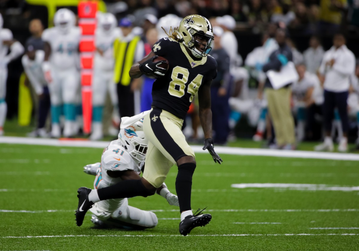 Aug 29, 2019; New Orleans, LA, USA; New Orleans Saints wide receiver Lil'Jordan Humphrey (84) catches a pass past Miami Dolphins defensive back Montre Hartage (41) during a preseason game at the Mercedes-Benz Superdome. Mandatory Credit: Derick E. Hingle-USA TODAY Sports