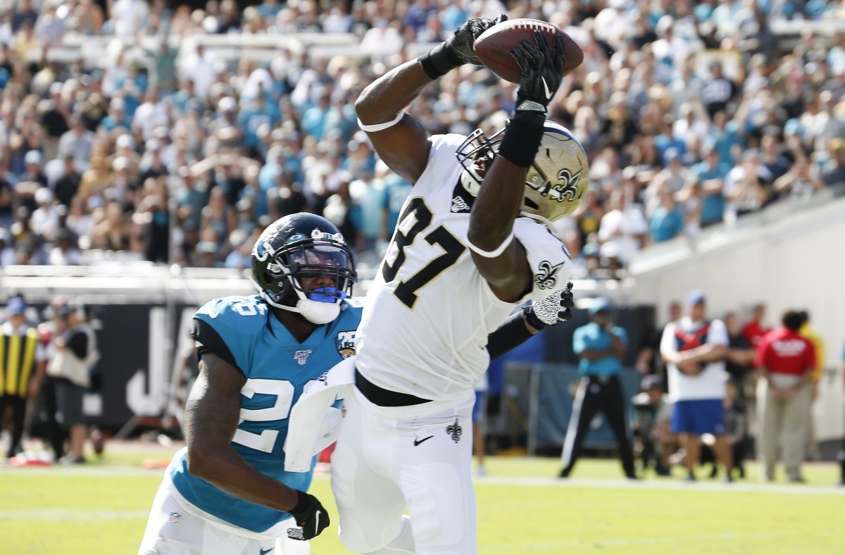 Oct 13, 2019; Jacksonville, FL, USA; New Orleans Saints tight end Jared Cook (87) catches a touchdown pass over Jacksonville Jaguars defensive back Jarrod Wilson (26) during the second half at TIAA Bank Field. Mandatory Credit: Reinhold Matay-USA TODAY